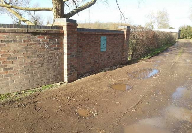 A Front garden wall repaired and extended using a matching cassandra brick at a job in Edingley, Nottingham