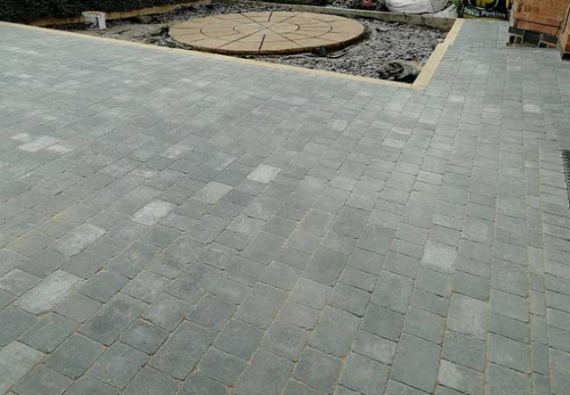 A concrete driveway uplifted, groundwork prepared and a bradstone woburn rumbled graphite pavior in three different sizes laid at a job in Carlton, Nottingham