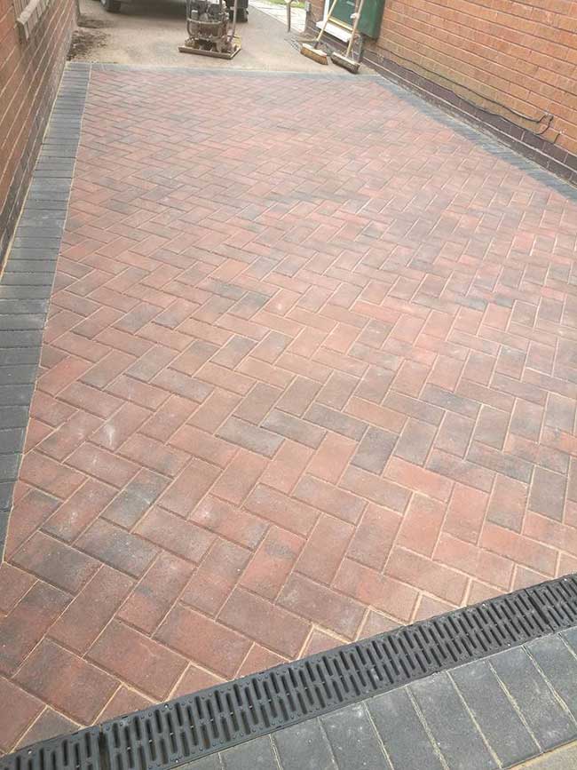 A small area block paved using Charcoal paviors around the edges and a brindle block paving infill on a job in Colwick, Nottingham