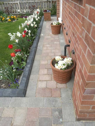 A concrete driveway uplifted, groundwork prepared then a marshalls tegula pavers, mixed harvest and traditional colours used to create this driveway in Hucknall, Nottingham.