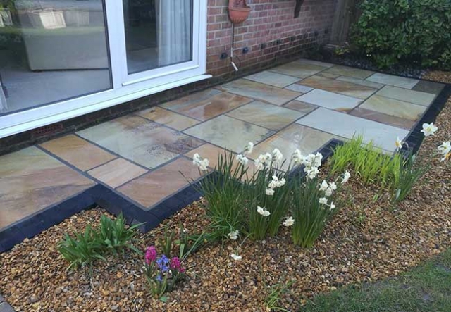 A rear patio we layed using a fossil buff indian sanstone at a job in Hucknall, Nottingham