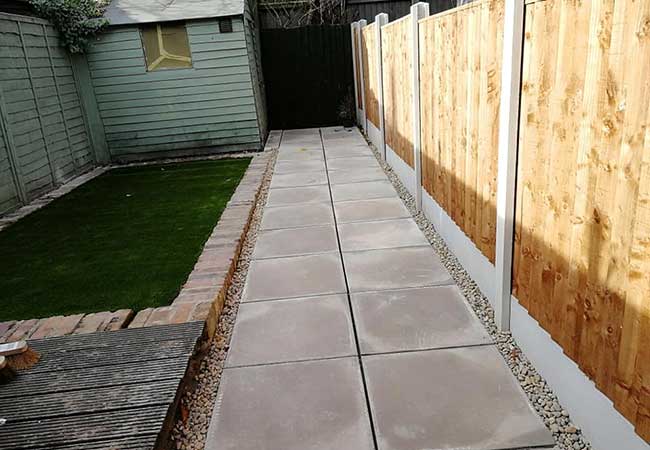A rear patio path we created using plain concrete slabs, artificail grass and a new fence at a property in Netherfield, Nottingham