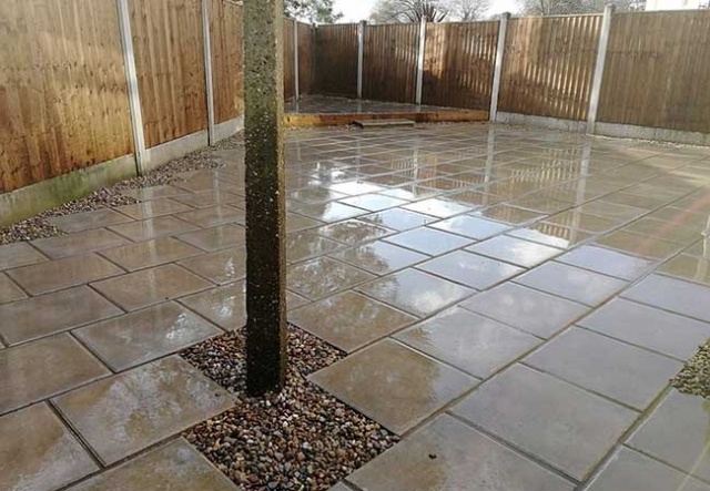A rear patio we installed using plain grey 450x450 slabs for a job in Carlton, Nottingham