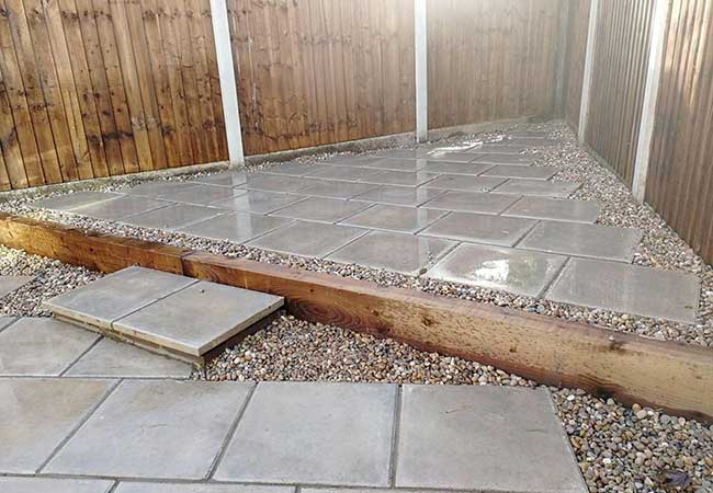 A rear patio we installed using plain grey 450x450 slabs for a job in Carlton, Nottingham
